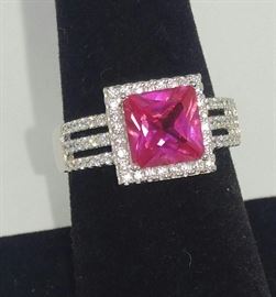 Pink Lab created Princess cut Sapphire in sterling silver surrounded by AAA
European Zirconia all hand set size 8