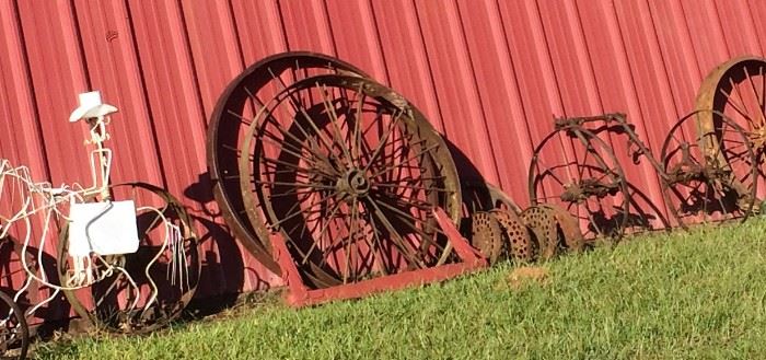 Closer Look at Some of the Wagon Wheels of Different Sizes and Types, Yard Art, Planters, Vintage Rusty Farm Equipment, Red Tractor Seat Stool & More!