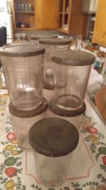 Rare find early 1920's jelly glasses with the metal lids. Check out that very hint of lavender color in the glass
