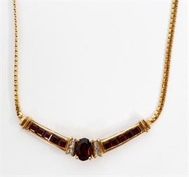 LADYS DIAMOND AND GARNET PENDANT ON A FANCY LINK NECK CHAIN
Lot # 1101 