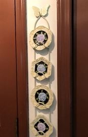 small decorative plates on plate rack
