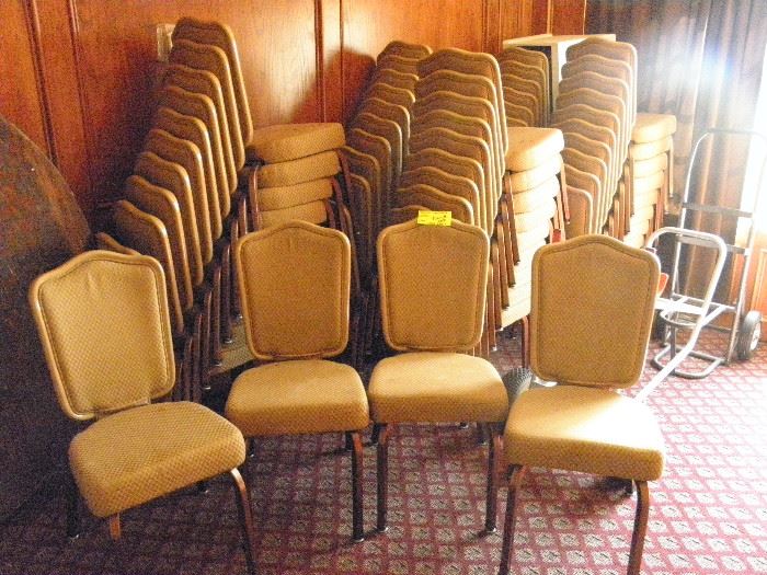 Stacking banquet chairs by GASSER of Youngstown Ohio.  Flex backs and 4 inch seat cushions. Soft gold in color, some need cleaning.    Have 150  plus or minus.  *******$25 to $15 each depending on volume****** Call Now for immediate appointment.  (760) 975-5483    (760) 445-8571