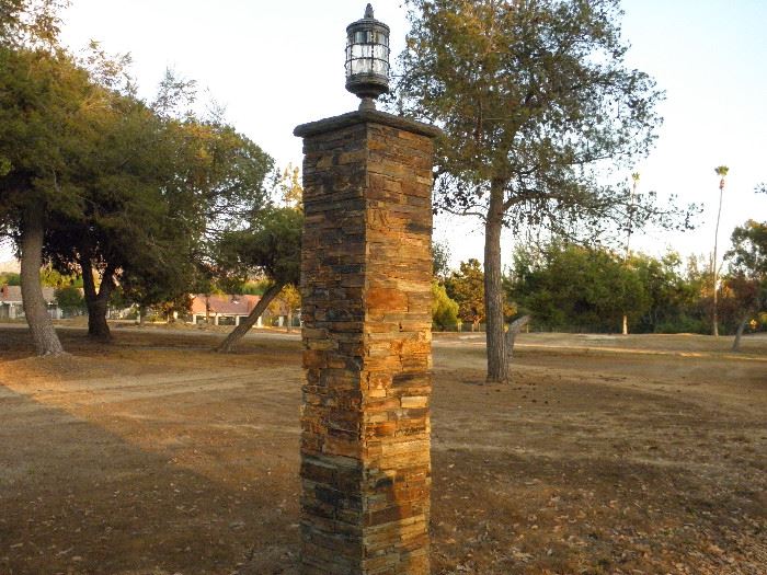 Stone Pillars with wrought Iron and steel hand made lanterns atop.  8 feet tall and 18 inches square.   U-remove *********$100 each w/ light*********  There are 17.  Call Now for immediate appointment.  (760) 975-5483    (760) 445-8571
