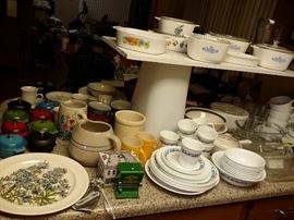 The kitchen is overflowing.  Nice corning ware.