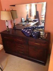 Vintage dresser/mirror with three folded American flags