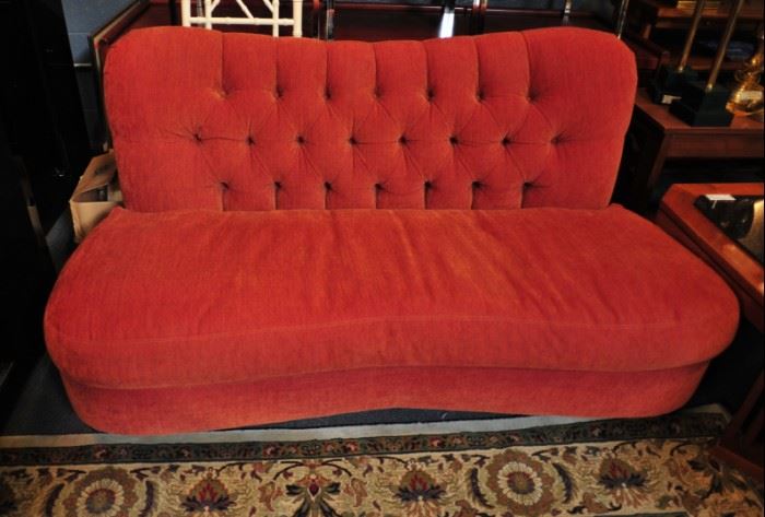 Turn-of-the-century tufted red love seat