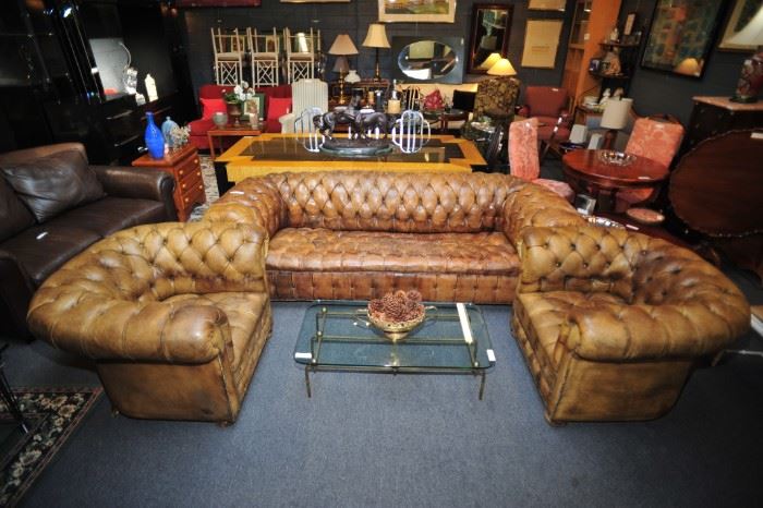 Mid-century antique tufted leather Chesterfield sofa with matching tufted barrel chairs