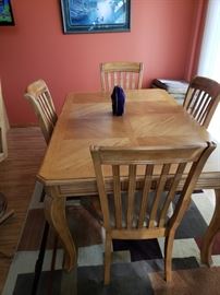 Dining room table and chairs, area rug