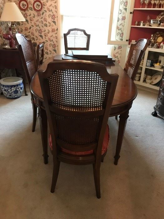 #1	dining table w 4 chairs and 2 leaves and pads 55-96x40x29 as is finish	 $175.00 	