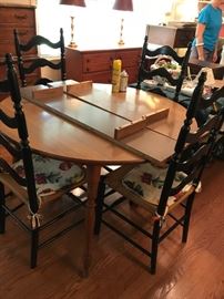 #36	Rockport Laminate round Table w/4 black chairs & 2 leaves   47-65x29	 $175.00 	