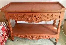 Buffet cart on wheels. 
Top folds open