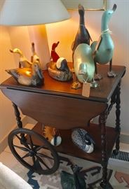 Wood drop leaf tea cart with various Smith & Hawken duck figurines & decoys. 