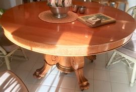 Antique round, claw foot pedestal dining table