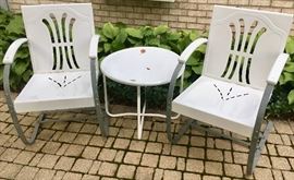 2 Metal Rock/bounce outdoor arm chairs 