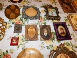 collection of miniature framed portraits