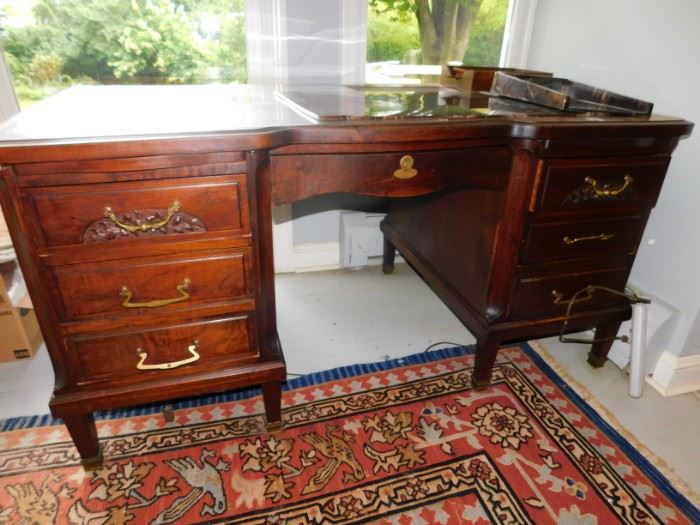 ornate carved wooden desk