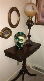 Mahogany game table, converted antique buffet oil lamp. 