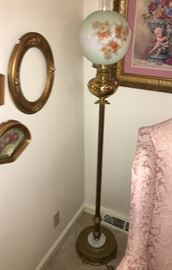 One of three antique converted oil floor lamps with shades, some are hand painted 