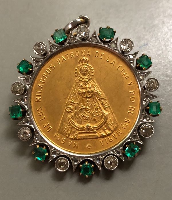 22k Gold Pope’s medal surrounded by 14k gold bezel with 9 diamonds, 18 diamond chips and 9 emeralds. 
