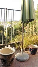 Sunbrella umbrella with stand. Garden pots