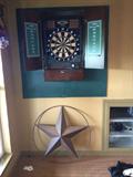 Dart board in a cabinet, with electronic scoring and music