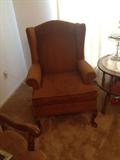 Pair of pumpkin colored wing chairs