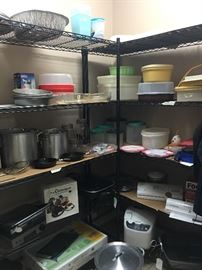 Several Aluminum Gumbo Pots, 
Martha Stewart Enameled Cast Iron (6qt. Round Casserole),
Geroge Foreman, Cast Iron Skillets, 
Regal Breadmaker, Presto Electric Skillet, Food Saver, Collection of Tupperware, Culinique Specialty Food Molding System, Reversible Grill/Griddle