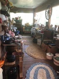 enamelware, wooden wheel, small tables, braided rugs, baskets