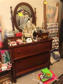 antique dresser and mirror, upright ladder style quilt rack, quilts