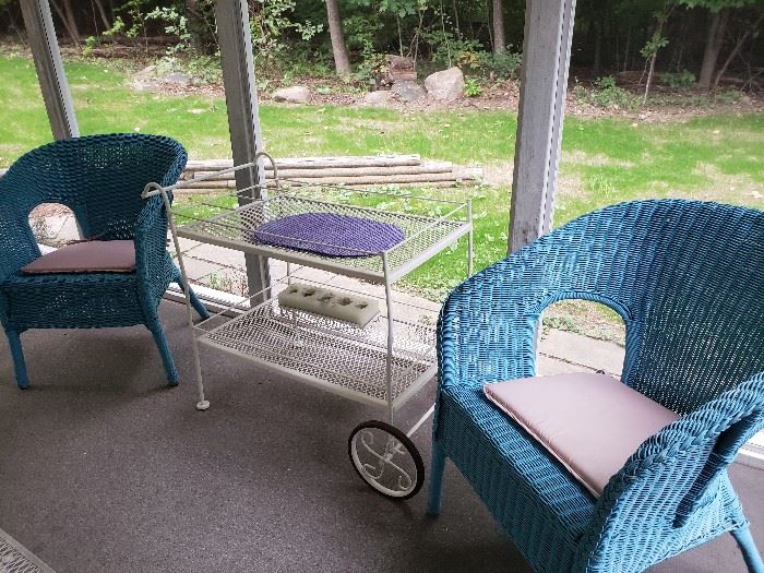 2 turquoise wicker chairs and white mesh tea cart. 