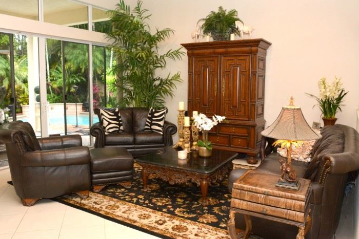 4 piece leather nailhead couches. sofa, love seat, armchair and ottoman.   coffee table.  armoire.  book sidetable