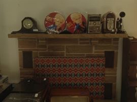 Mantel clock, Billy Idol pic discs, old transistor radio, telephone