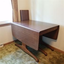 Mid-century table with extra leaves. Seats up to 14 people