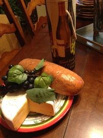 Decorative bread, grapes, and cheese
