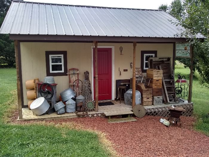 Lots of wood crates, aluminum wash buckets, chicken feeders & water bins, cast metal cauldrons, cast fireplace items, sewing machine stand, industrial cart and more!