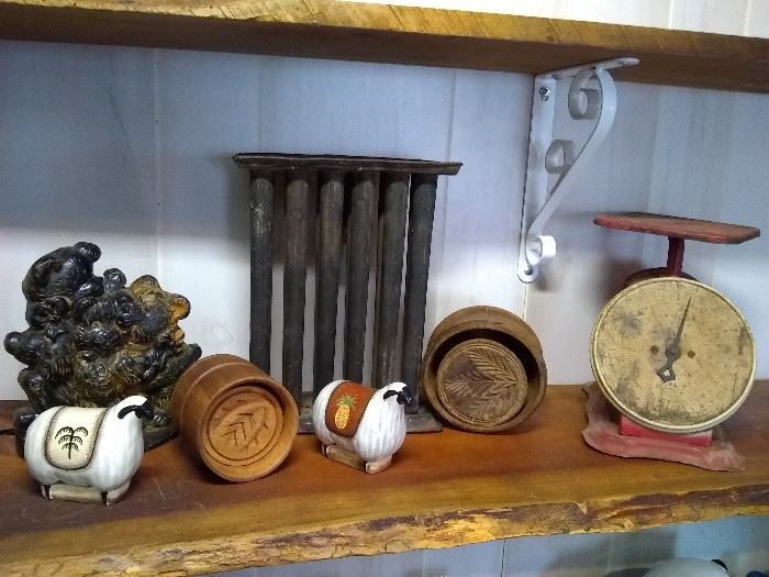 Vintage butter presses, old tin candle mold, Landers Frary & Clark kitchen scale, antique cast door stop and sheep S&P set