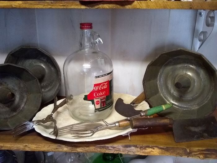 Vintage kitchen items and old Coke Cola syrup bottle