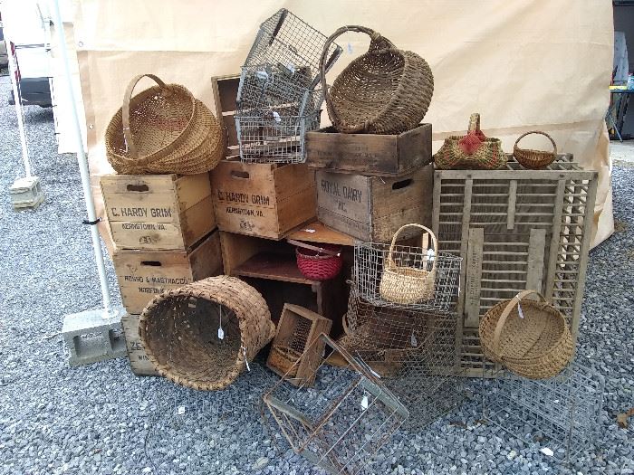Lots of primitive baskets, wire baskets, Turkey cage and old apple crates and boxes