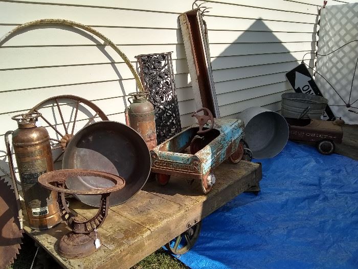 More treasures...old wheels, old piece from Richmond VA foundry, peddle cars, lots of old buckets, industrial cart, industrial dolley, vintage fire extinguishers, old wrought iron pieces and more....