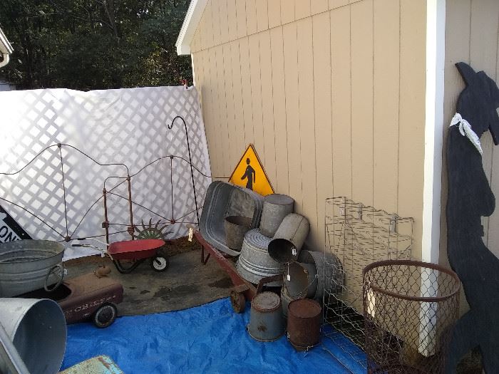 More treasures to be found...more buckets and wash tubs, old oil can storage stand, old wrought iron bed (great for garden decor!), metal signs and more!