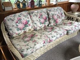 Rattan couch - there are 2, plus a round matching table and chair with ottoman