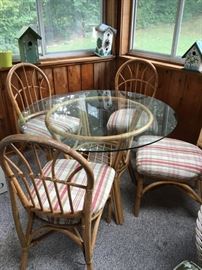 bamboo table with glass top + 4 chairs