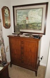 Chest of drawers, Lighthouse print, wall clocks, etc