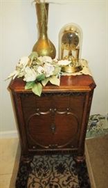 Small antique chest, anniversary clocks, brass vase