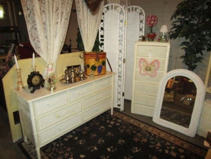 Wicker bedroom furniture including dresser, room divider, tall chest of drawers, mirror, headboard