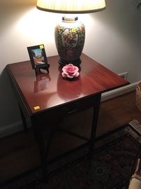 Pair of drop-leaf mahogany Side Tables with pair of ginger-jar style Wildwood Lamps and a Capodimonte porcelain rose 
