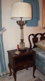 one of pair of bedside tables and lamps