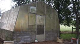Old greenhouse full of pots