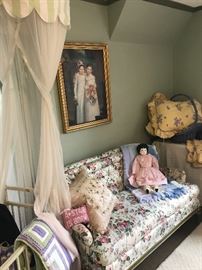 Small floral love seat in the girls bedroom was a lovely oil painting above