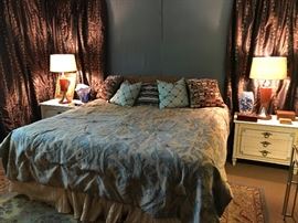 King sized mattress and box springs flaked by a pair of Jonathan Widicome night stands